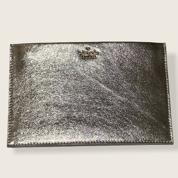 kate spade Handbags - Kate Spade slim pouch wristlet Silver NWOT